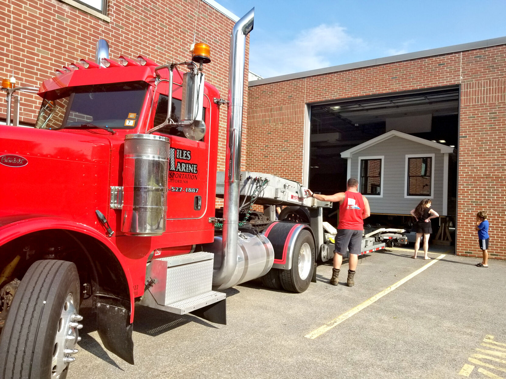 Latest student-built tiny home, now merely small, rolls off to a permanent location in Bridgewater